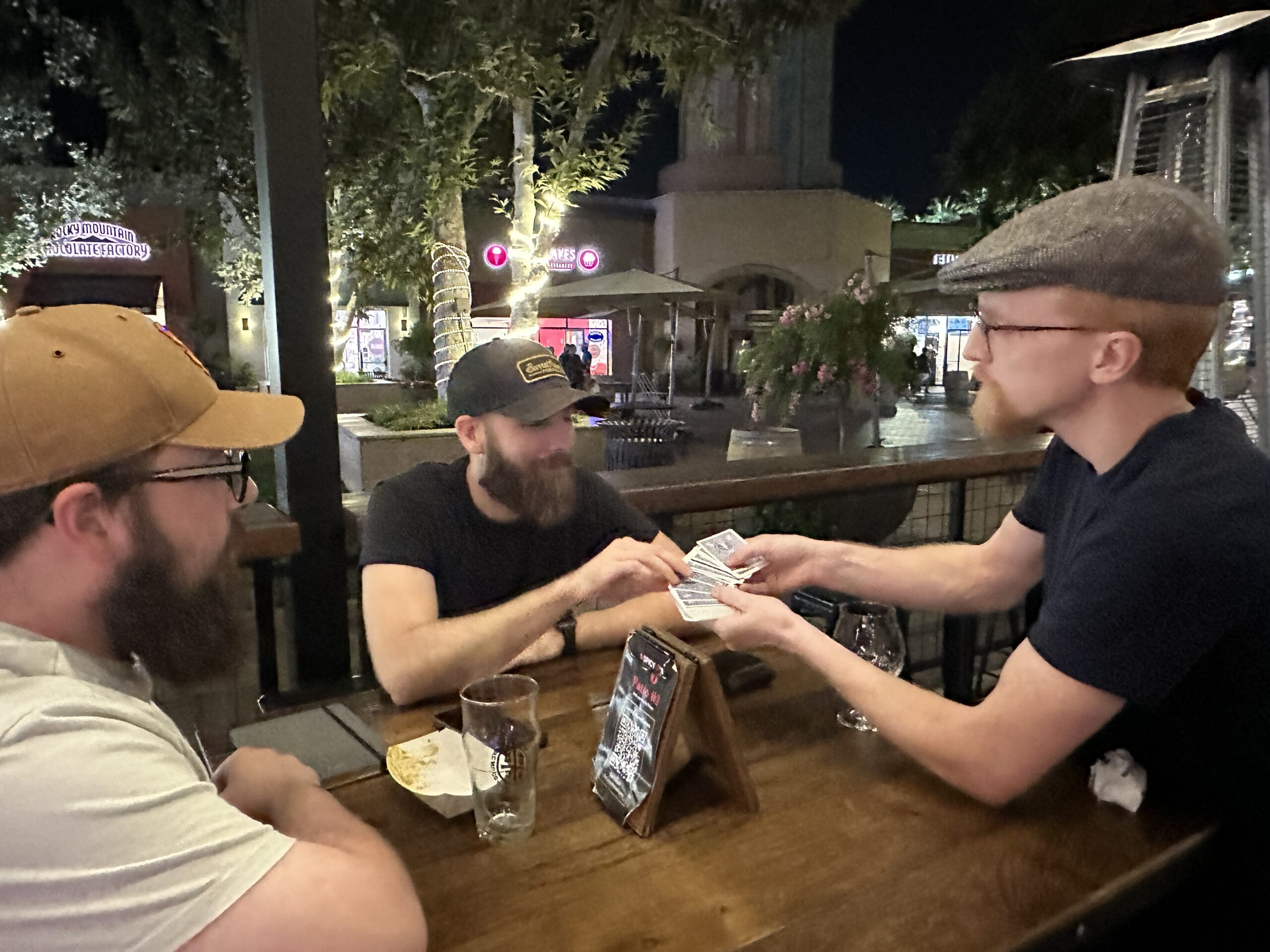 Magician asking spectator to choose a card