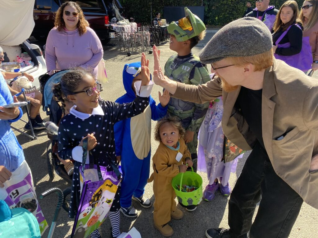 Magic Mabe high-fiving an excited spectator